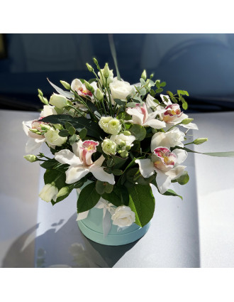 White orchids in hat box