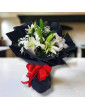 White lilies in a dark package